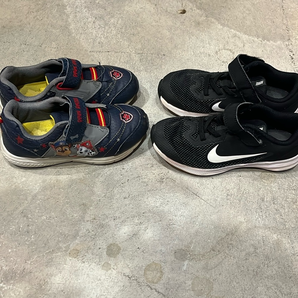 Young boy lot of shoes